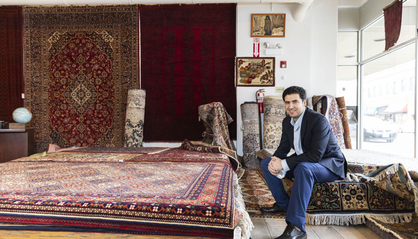 For Afghan refugees, traditional rugs offer comfort